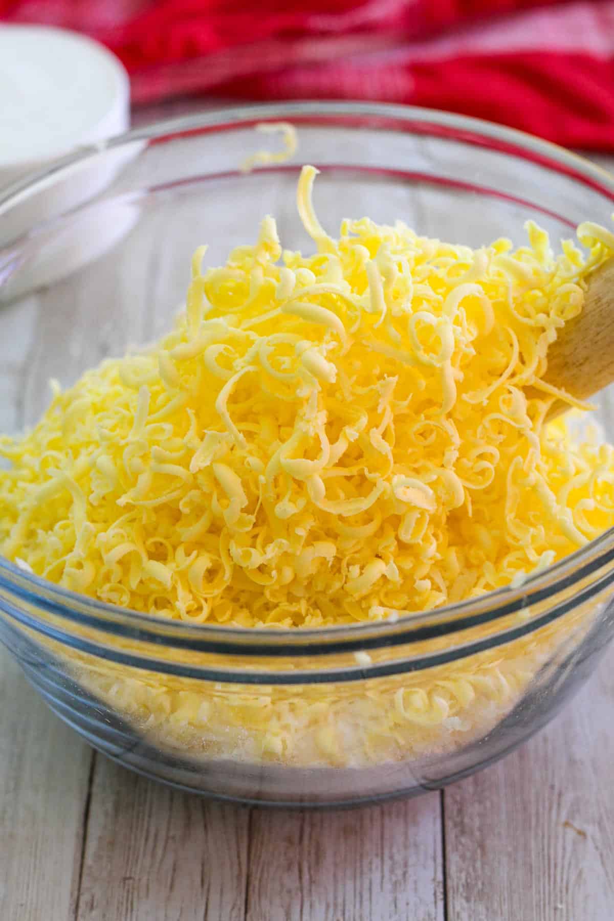 Grated butter added over dough ingredients.