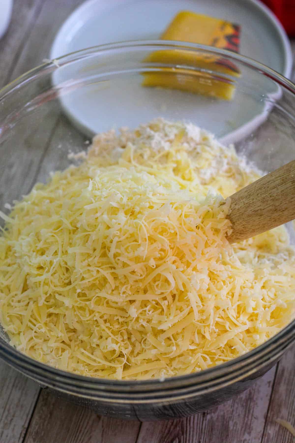 Shredded cheese added to mixing bowl.