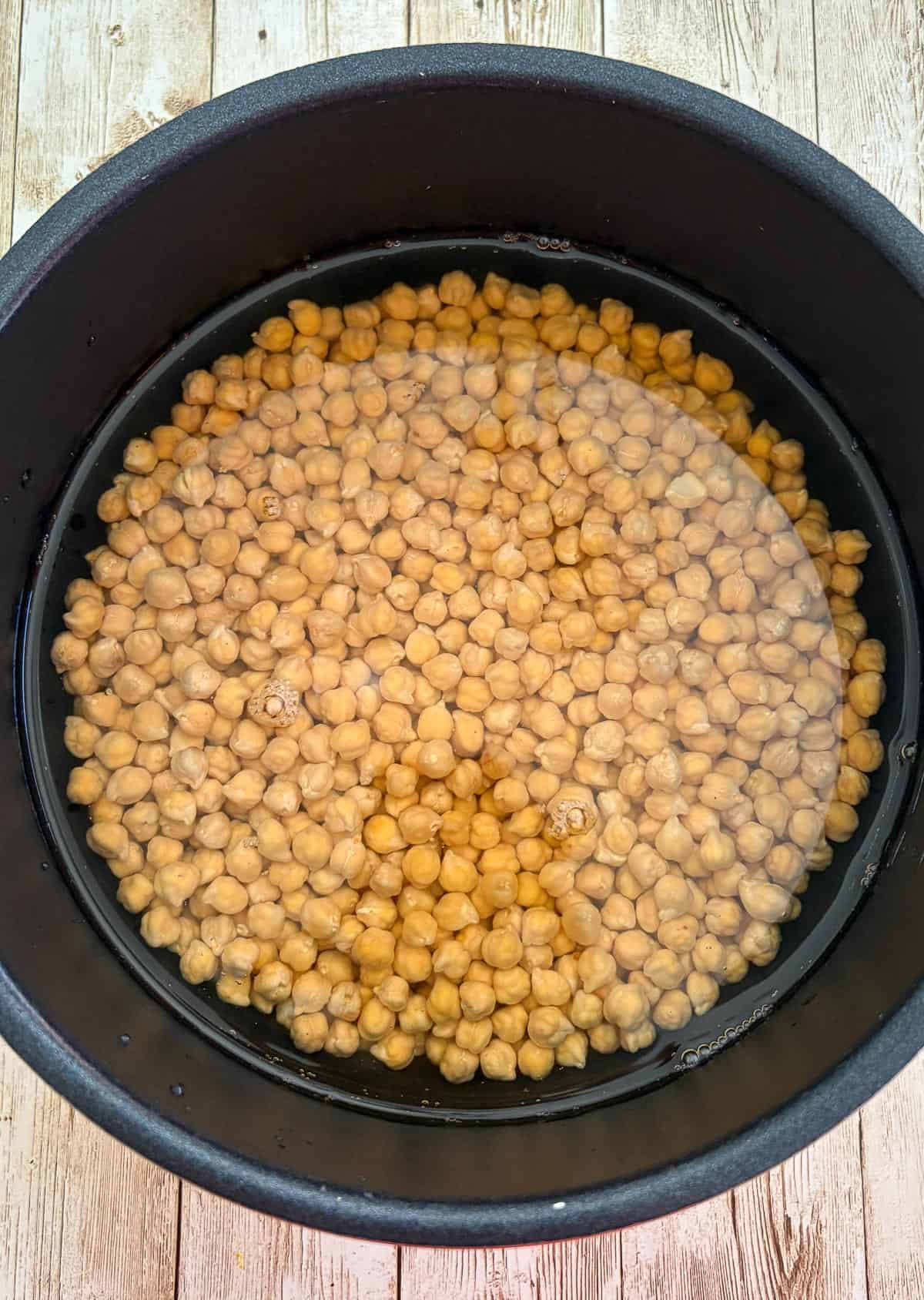 Chickpeas in water in a pressure cooker.