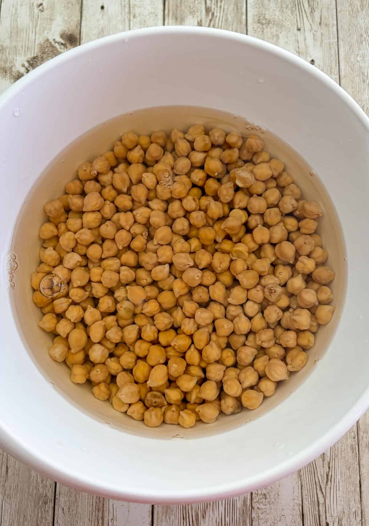 Chickpeas in water in a bowl.
